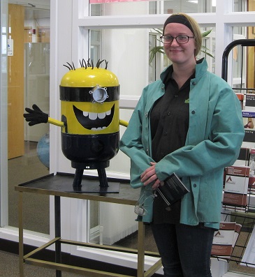 Kaylia Nelkie with her Minion; fabricated out of a propane tank.